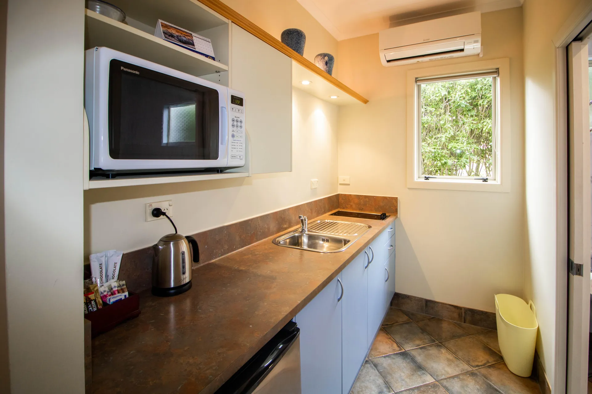 One Bedroom Unit Kitchenette One bedroom unit kitchenette with sink, hob, microwave, kettle and tea and coffee supplies