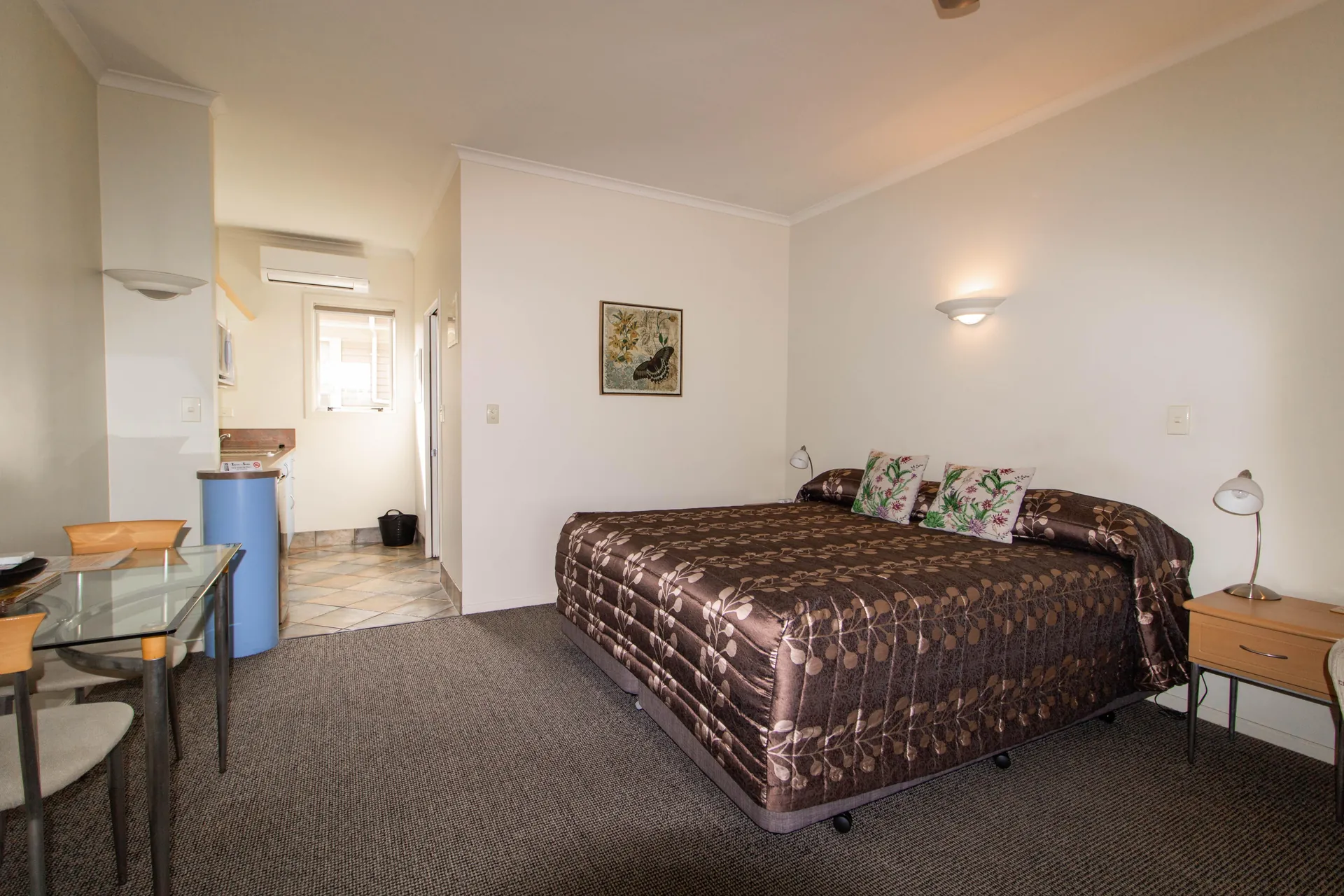 Studio Twin Beds and Sofa Twin Studio with two beds, sofa and glass dining table at Tuscany on Thames