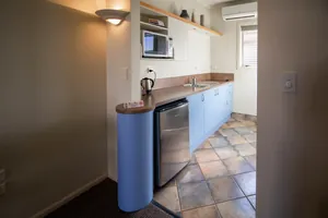 Studio Kitchenette and Fridge Studio kitchenette bench with fridge, sink, microwave and kettle
